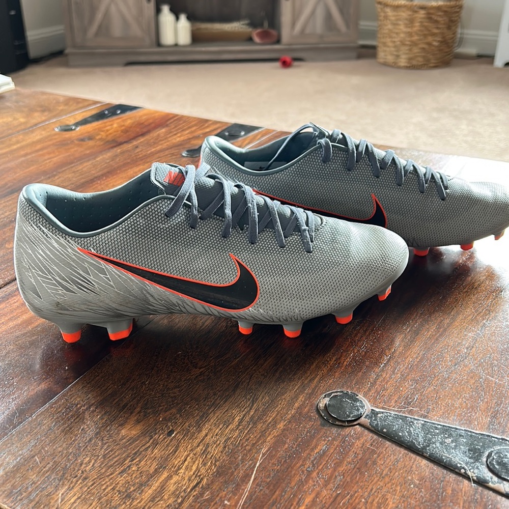 Nike Mercurial cleats grey with orange accents